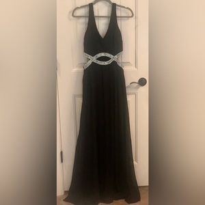 Xtraordinary black gown with Rhinstone infinity waist. Size 7. Never worn.